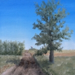 Road to Town is a 12”x9” original oil painting on canvas of a gravel road in farm country with a small rural town with a water tower in the distance.